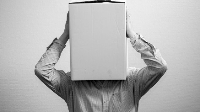 man with box over his head