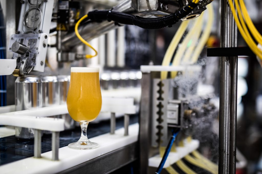 glass of beer on production line